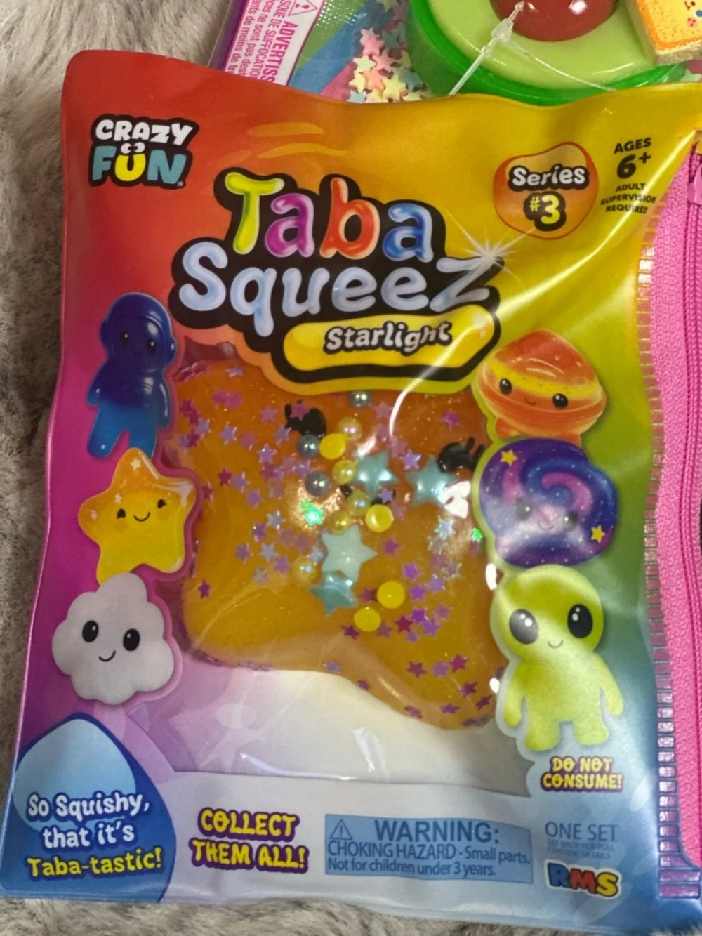 A Bundle of Squeezable’s with one orange NEE DOH FUNKY PUP. New